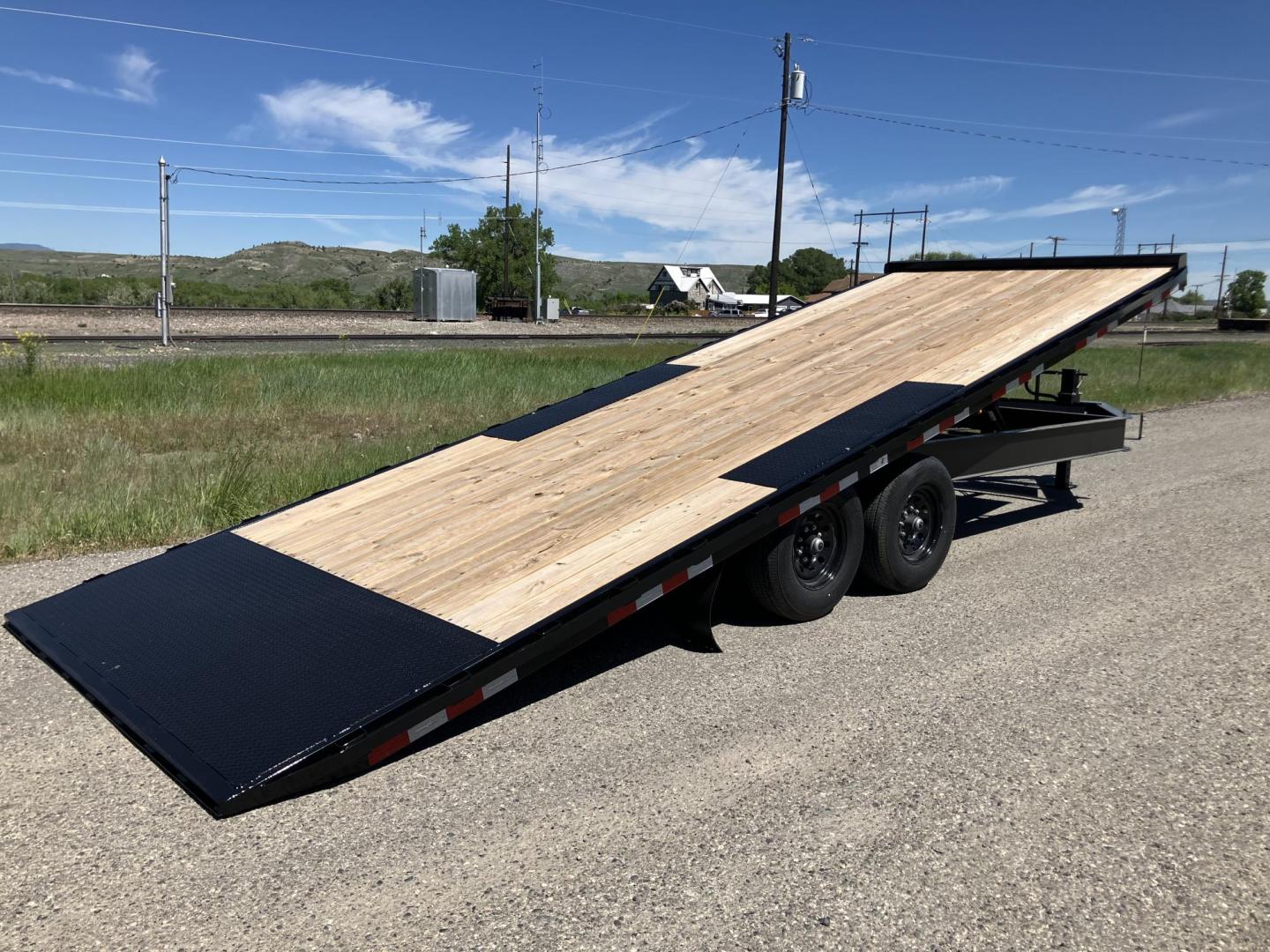 2025 , located at 310 West 1st Ave, Big Timber, MT, 59011, (406) 901-0517, 45.833511, -109.957809 - New Trailerman 81/2 x 24 Power Tilt deckover, 14K GVW, (2) 7k axles with electric brakes and quick lube hubs, HD slipper spring suspension, 12k drop leg jack, dual ram hoist with power up/down, wireless remote, 110V battery charger, all LED lights, 2-5/16" adjustable coupler, 16" - 10 ply radial tir - Photo#0