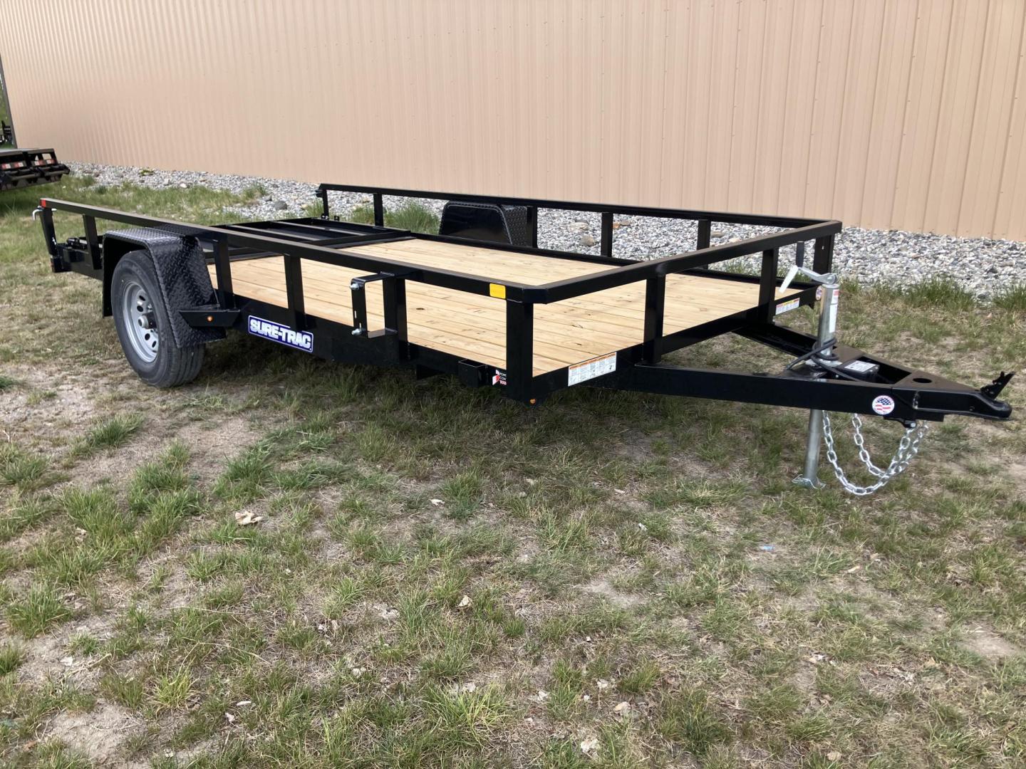 2026 , located at 40 Big Timber RD, Big Timber, MT, 59011, (406) 901-0517, 45.836796, -109.943535 - New SureTrac 7 x 14 Utility Trailer, 5k GVW single axle with electric brakes, 15"-8 ply radial tires, 2" x 2" tube - top rail, 2" x 2" tube uprights, stake pockets, 2k top wind jack, treated wood deck, (3) position rear gate, 2" coupler, all lights LED, spare tire mount, powder coat finish. Optio - Photo#4