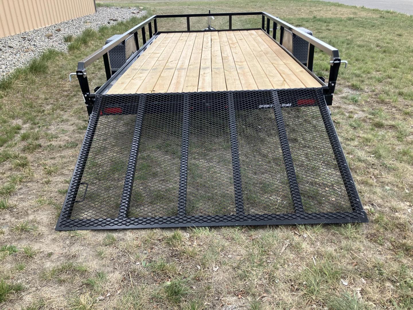 2026 , located at 40 Big Timber RD, Big Timber, MT, 59011, (406) 901-0517, 45.836796, -109.943535 - New SureTrac 7 x 14 Utility Trailer, 5k GVW single axle with electric brakes, 15"-8 ply radial tires, 2" x 2" tube - top rail, 2" x 2" tube uprights, stake pockets, 2k top wind jack, treated wood deck, (3) position rear gate, 2" coupler, all lights LED, spare tire mount, powder coat finish. Optio - Photo#6