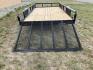 2026 , located at 40 Big Timber RD, Big Timber, MT, 59011, (406) 901-0517, 45.836796, -109.943535 - New SureTrac 7 x 14 Utility Trailer, 5k GVW single axle with electric brakes, 15"-8 ply radial tires, 2" x 2" tube - top rail, 2" x 2" tube uprights, stake pockets, 2k top wind jack, treated wood deck, (3) position rear gate, 2" coupler, all lights LED, spare tire mount, powder coat finish. Optio - Photo#6