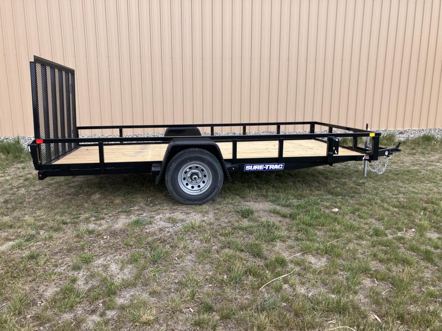 2026 , located at 40 Big Timber RD, Big Timber, MT, 59011, (406) 901-0517, 45.836796, -109.943535 - New SureTrac 7 x 14 Utility Trailer, 5k GVW single axle with electric brakes, 15"-8 ply radial tires, 2" x 2" tube - top rail, 2" x 2" tube uprights, stake pockets, 2k top wind jack, treated wood deck, (3) position rear gate, 2" coupler, all lights LED, spare tire mount, powder coat finish. Optio - Photo#7
