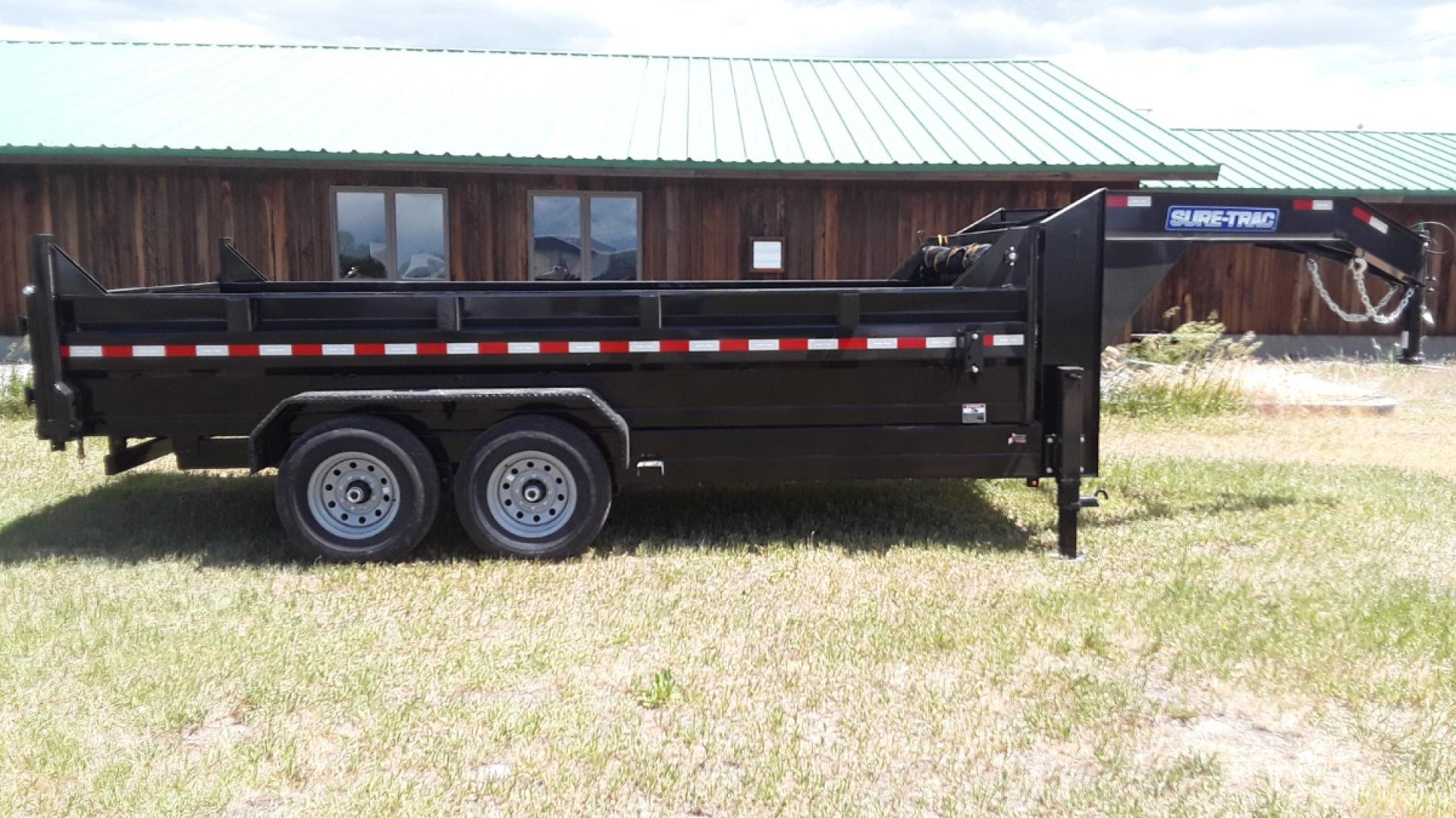 2025 Black SureTrac 7 x 14 LoPro Dump , located at 310 West 1st Ave, Big Timber, MT, 59011, (406) 901-0517, 45.833511, -109.957809 - SURE-TRAC 7 x 14 HD LO PRO DUMP TRAILER, 14K GVW, TELESCOPIC HOIST, UNDERBODY TOOL STORAGE BOX, STAKE POCKETS ON SIDE, MESH TARP, 110 VOLT BATTERY CHARGER, SIDE STEP, EZ LUBE HUBS, HD SLIPPER SPRING SUSPENSION, 16" RADIAL 10 PLY TIRES, BRAKES BOTH AXLES, SPREADER-BARN DOOR REAR GATE, REAR RAMPS, 10 - Photo#7