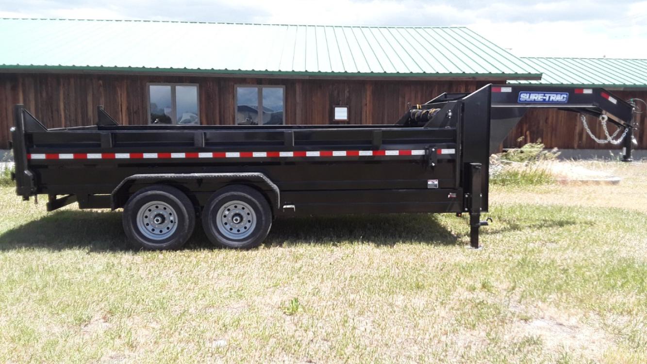 2022 Black SureTrac 7 x 14 LoPro Dump , located at 310 West 1st Ave, Big Timber, MT, 59011, (406) 860-8510, 45.833511, -109.957809 - SURE-TRAC 7 x 14 LO PRO DUMP TRAILER, 14K GVW, CHOICE OF DUAL RAM, SCISSOR OR TELESCOPIC HOIST, UNDERBODY TOOL STORAGE BOX, STAKE POCKETS ON SIDE, MESH TARP, 110 VOLT BATTERY CHARGER, SIDE STEP, EZ LUBE HUBS, HD SLIPPER SPRING SUSPENSION, 16