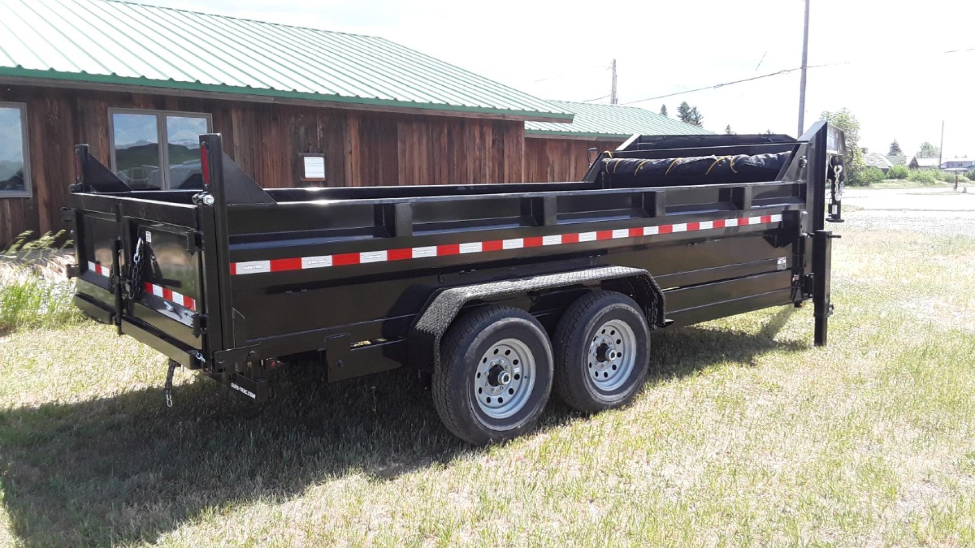 2025 Black SureTrac 7 x 14 LoPro Dump , located at 310 West 1st Ave, Big Timber, MT, 59011, (406) 901-0517, 45.833511, -109.957809 - SURE-TRAC 7 x 14 HD LO PRO DUMP TRAILER, 14K GVW, TELESCOPIC HOIST, UNDERBODY TOOL STORAGE BOX, STAKE POCKETS ON SIDE, MESH TARP, 110 VOLT BATTERY CHARGER, SIDE STEP, EZ LUBE HUBS, HD SLIPPER SPRING SUSPENSION, 16" RADIAL 10 PLY TIRES, BRAKES BOTH AXLES, SPREADER-BARN DOOR REAR GATE, REAR RAMPS, 10 - Photo#4