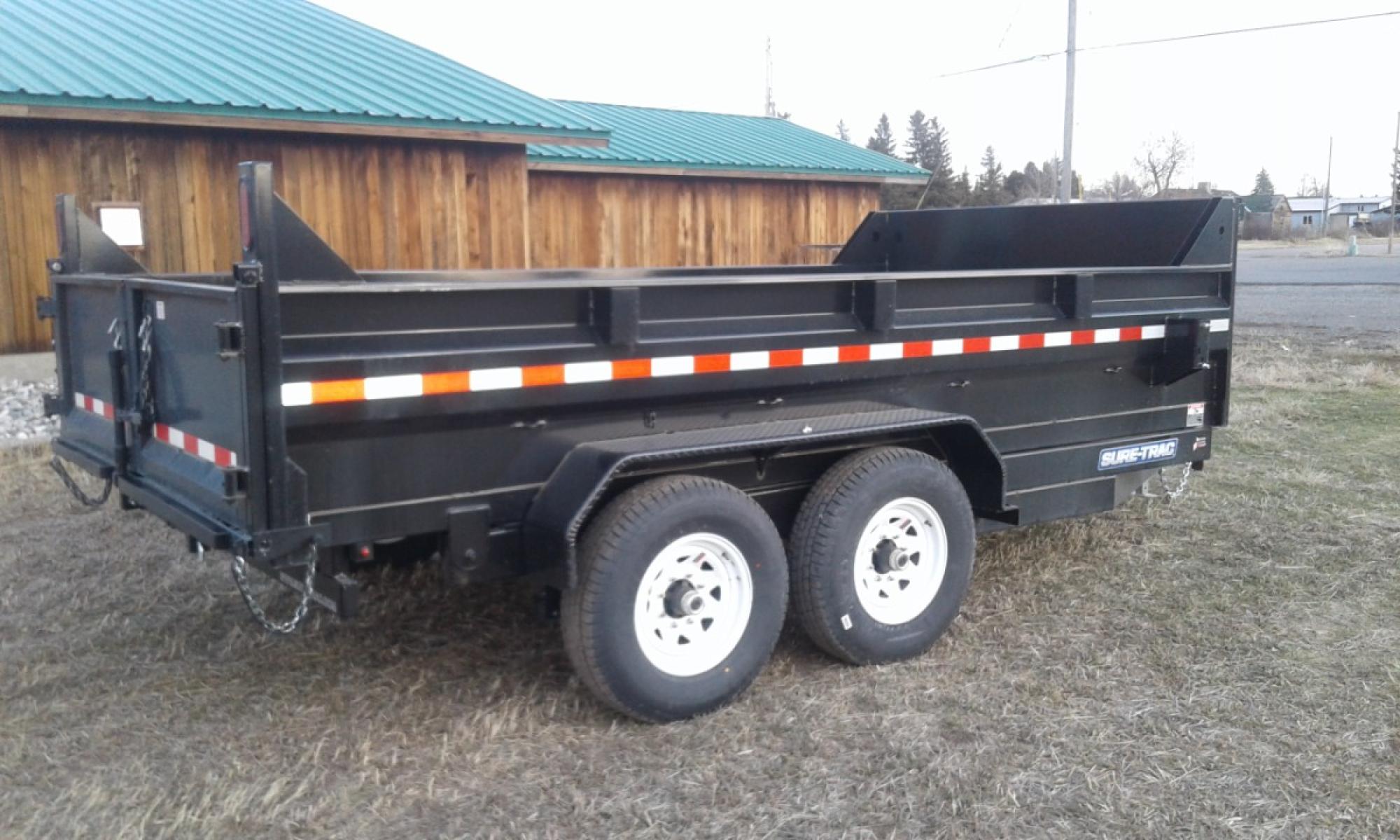 2022 Black SureTrac 7 x 14 LoPro Dump , located at 310 West 1st Ave, Big Timber, MT, 59011, (406) 860-8510, 45.833511, -109.957809 - SURE-TRAC 7 x 14 LO PRO DUMP TRAILER, 14K GVW, CHOICE OF DUAL RAM, SCISSOR OR TELESCOPIC HOIST, UNDERBODY TOOL STORAGE BOX, STAKE POCKETS ON SIDE, MESH TARP, 110 VOLT BATTERY CHARGER, SIDE STEP, EZ LUBE HUBS, HD SLIPPER SPRING SUSPENSION, 16" RADIAL 10 PLY TIRES, BRAKES BOTH AXLES, SPREADER-BARN DOO - Photo #1
