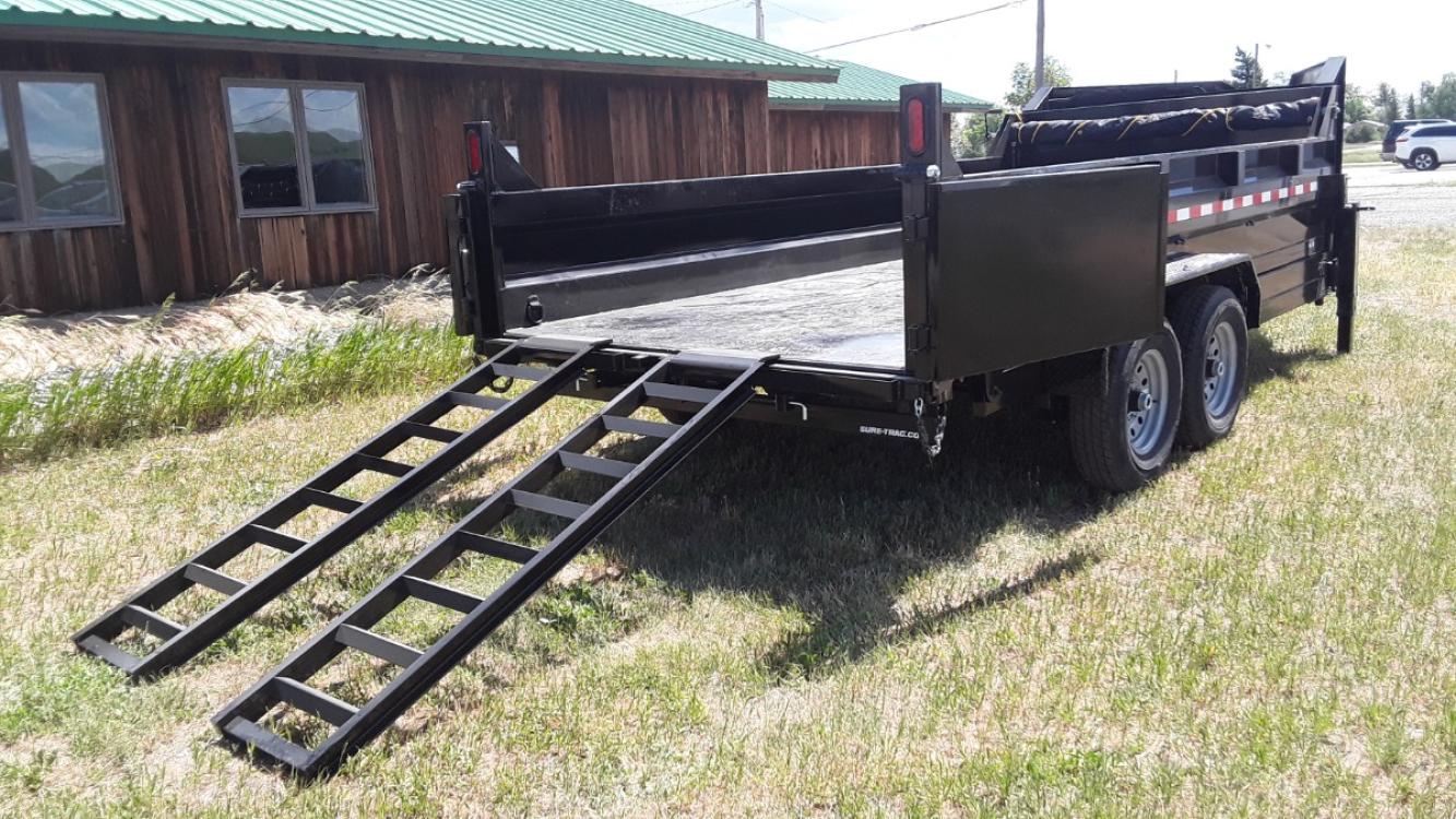 2022 Black SureTrac 7 x 14 LoPro Dump , located at 310 West 1st Ave, Big Timber, MT, 59011, (406) 860-8510, 45.833511, -109.957809 - SURE-TRAC 7 x 14 LO PRO DUMP TRAILER, 14K GVW, CHOICE OF DUAL RAM, SCISSOR OR TELESCOPIC HOIST, UNDERBODY TOOL STORAGE BOX, STAKE POCKETS ON SIDE, MESH TARP, 110 VOLT BATTERY CHARGER, SIDE STEP, EZ LUBE HUBS, HD SLIPPER SPRING SUSPENSION, 16