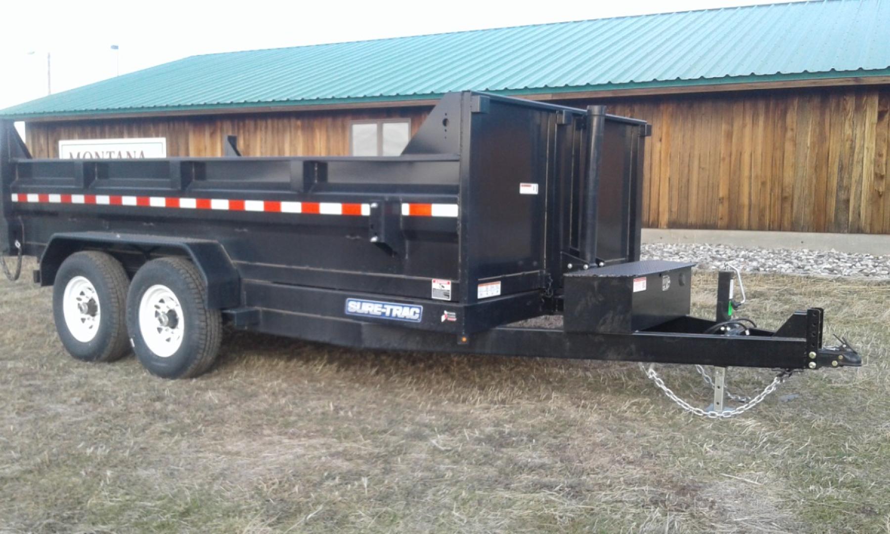 2025 Black SureTrac 7 x 14 LoPro Dump , located at 310 West 1st Ave, Big Timber, MT, 59011, (406) 901-0517, 45.833511, -109.957809 - SURE-TRAC 7 x 14 HD LO PRO DUMP TRAILER, 14K GVW, TELESCOPIC HOIST, UNDERBODY TOOL STORAGE BOX, STAKE POCKETS ON SIDE, MESH TARP, 110 VOLT BATTERY CHARGER, SIDE STEP, EZ LUBE HUBS, HD SLIPPER SPRING SUSPENSION, 16" RADIAL 10 PLY TIRES, BRAKES BOTH AXLES, SPREADER-BARN DOOR REAR GATE, REAR RAMPS, 10 - Photo#11