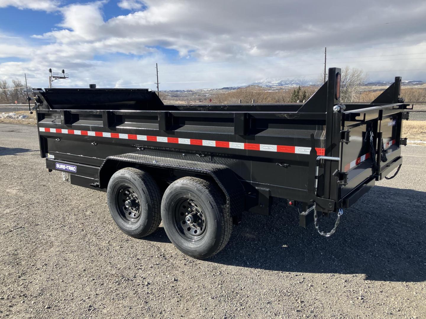 2025 Black SureTrac 7 x 14 LoPro Dump , located at 310 West 1st Ave, Big Timber, MT, 59011, (406) 901-0517, 45.833511, -109.957809 - SURE-TRAC 7 x 14 HD LO PRO DUMP TRAILER, 14K GVW, TELESCOPIC HOIST, UNDERBODY TOOL STORAGE BOX, STAKE POCKETS ON SIDE, MESH TARP, 110 VOLT BATTERY CHARGER, SIDE STEP, EZ LUBE HUBS, HD SLIPPER SPRING SUSPENSION, 16" RADIAL 10 PLY TIRES, BRAKES BOTH AXLES, SPREADER-BARN DOOR REAR GATE, REAR RAMPS, 10 - Photo#2