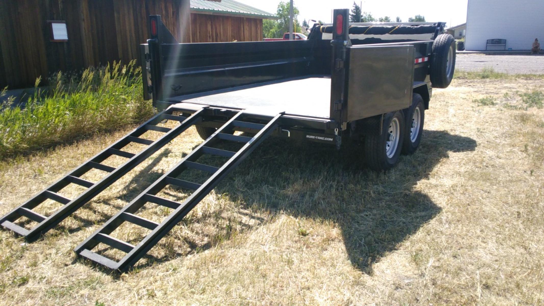 2022 Black SureTrac 7 x 12 LoPro Dump , located at 310 West 1st Ave, Big Timber, MT, 59011, (406) 860-8510, 45.833511, -109.957809 - SURETRAC 7 X 12 LOPRO DUMP, 14K GVW, 2 - 7K AXLES W- ELECTRIC BRAKES, HD SLIPPER SPRING SUSPENSION AND EZ LUBE HUBS, DUAL REAR GATE, REAR RAMPS, LED LIGHTS, 16" - 10 PLY RADIAL TIRES, 10 GA FLOOR, (5) D-RING TIE DOWNS. SPARE MOUNT, 12K DROP LEG JACK, DEEP CYCLE BATTERY, MESH TARP, 110 VOLT BATTERY C - Photo #6