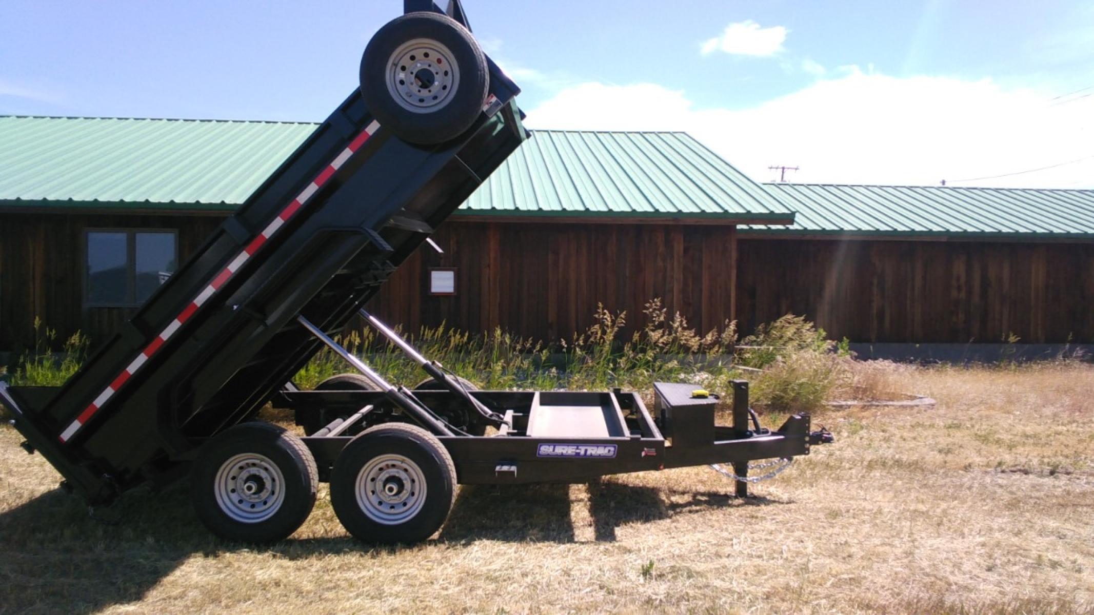 2022 Black SureTrac 7 x 12 LoPro Dump , located at 310 West 1st Ave, Big Timber, MT, 59011, (406) 860-8510, 45.833511, -109.957809 - SURETRAC 7 X 12 LOPRO DUMP, 14K GVW, 2 - 7K AXLES W- ELECTRIC BRAKES, HD SLIPPER SPRING SUSPENSION AND EZ LUBE HUBS, DUAL REAR GATE, REAR RAMPS, LED LIGHTS, 16" - 10 PLY RADIAL TIRES, 10 GA FLOOR, (5) D-RING TIE DOWNS. SPARE MOUNT, 12K DROP LEG JACK, DEEP CYCLE BATTERY, MESH TARP, 110 VOLT BATTERY C - Photo #7