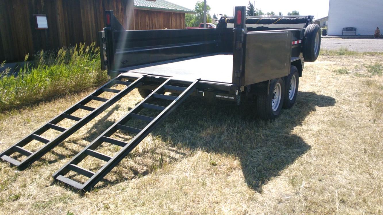 2022 Black SureTrac 7 x 12 LoPro Dump , located at 310 West 1st Ave, Big Timber, MT, 59011, (406) 860-8510, 45.833511, -109.957809 - SURETRAC 7 X 12 LOPRO DUMP, 14K GVW, 2 - 7K AXLES W- ELECTRIC BRAKES, HD SLIPPER SPRING SUSPENSION AND EZ LUBE HUBS, DUAL REAR GATE, REAR RAMPS, LED LIGHTS, 16