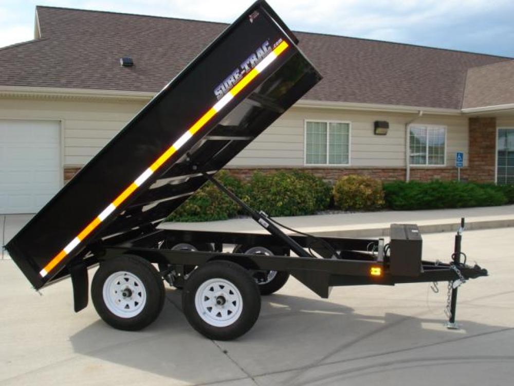 2022 Black SureTrac 6 x 10 Deckover Dump Trailer , located at 80 Big Timber Loop Road, Big Timber, MT, 59011, (406) 860-8510, 45.837139, -109.951393 - ONE OF THE LITTLE WORKHORES'- THIS DECKOVER DUMP IS GREAT FOR AROUND THE HOUSE AND SMALL ACERAGES. DON'T LET THE SIZE AND PRICE FOOL YOU, THIS UNIT WILL DO A LOT OF WORK! 6' X 10' DECKOVER DUMP, 7K GVW, SINGLE RAM HOIST, DUAL REAR GATE, BRAKES BOTH AXLES, EZ LUBE HUBS, LED LIGHTS, POWDERCOAT FINIS - Photo #5
