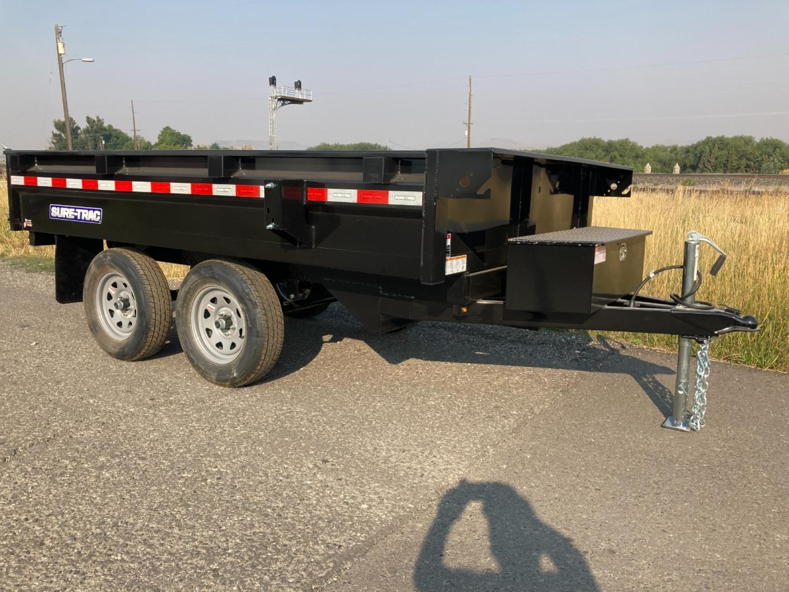 2023 Black SureTrac 6 x 10 Deckover Dump Trailer , located at 310 West 1st Ave, Big Timber, MT, 59011, (406) 860-8510, 45.833511, -109.957809 - ONE OF THE LITTLE WORKHORES'- THIS DECKOVER DUMP IS GREAT FOR AROUND THE HOUSE AND SMALL ACERAGES. DON'T LET THE SIZE AND PRICE FOOL YOU, THIS UNIT WILL DO A LOT OF WORK! 6' X 10' DECKOVER DUMP, 7K GVW, SINGLE RAM HOIST, DUAL REAR GATE, BRAKES BOTH AXLES, EZ LUBE HUBS, LED LIGHTS, POWDERCOAT FINIS - Photo #2