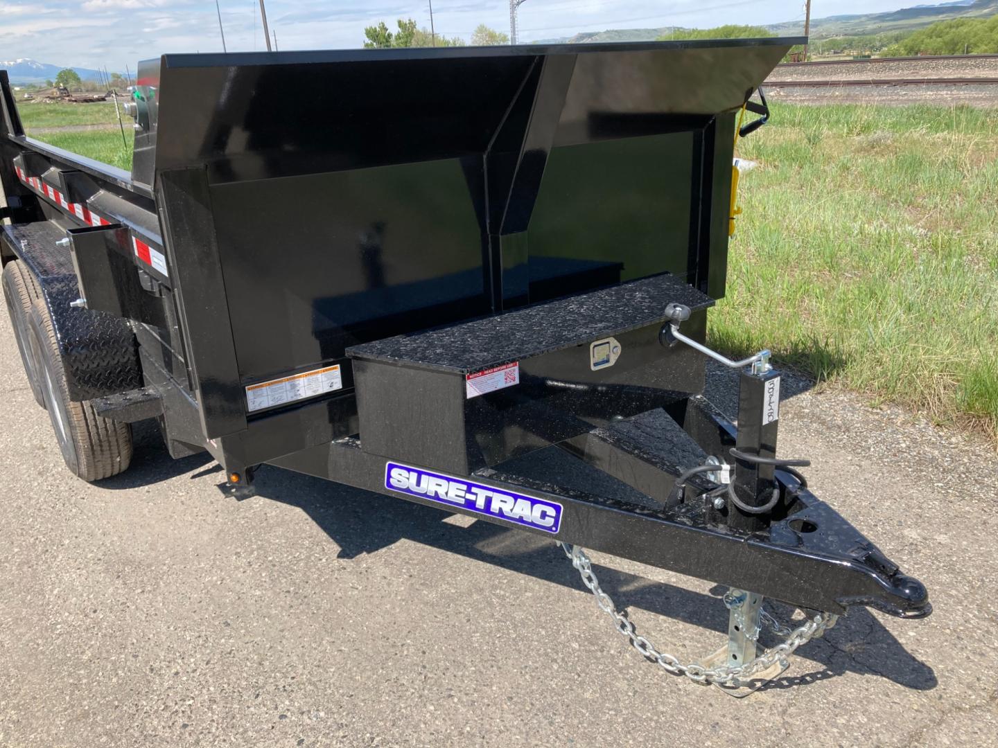 2025 Black SureTrac 6 x10 Lo Pro Dump Trailer , located at 310 West 1st Ave, Big Timber, MT, 59011, (406) 901-0517, 45.833511, -109.957809 - SURE-TRAC 6 X 10 LO PRO DUMP TRAILER, 10K GVW, SINGLE RAM HOIST WITH POWER UP/DOWN, EZ LUBE HUBS, DUAL REAR GATE, ELECTRIC BRAKES BOTH AXLES, (5) D-RING TIE-DOWNS, LED LIGHTS, REAR STOW RAMPS, MESH TARP, DEEP CYCLE BATTERY, 225-15" - 8 PLY RADIAL TIRES, SPARE TIRE CARRIER, 7K DROP FOOT JACK, LOCKABL - Photo#2