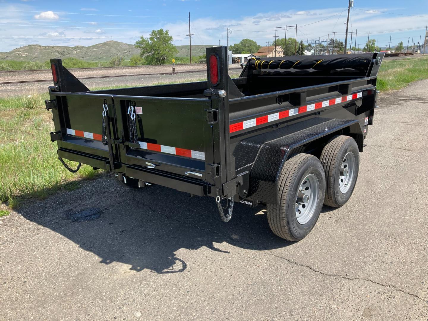 2025 Black SureTrac 6 x10 Lo Pro Dump Trailer , located at 310 West 1st Ave, Big Timber, MT, 59011, (406) 901-0517, 45.833511, -109.957809 - SURE-TRAC 6 X 10 LO PRO DUMP TRAILER, 10K GVW, SINGLE RAM HOIST WITH POWER UP/DOWN, EZ LUBE HUBS, DUAL REAR GATE, ELECTRIC BRAKES BOTH AXLES, (5) D-RING TIE-DOWNS, LED LIGHTS, REAR STOW RAMPS, MESH TARP, DEEP CYCLE BATTERY, 225-15" - 8 PLY RADIAL TIRES, SPARE TIRE CARRIER, 7K DROP FOOT JACK, LOCKABL - Photo#3
