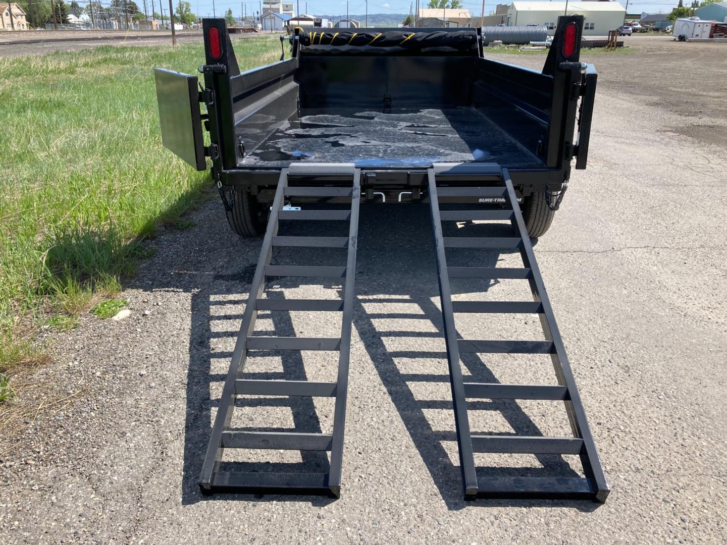 2025 Black SureTrac 6 x10 Lo Pro Dump Trailer , located at 310 West 1st Ave, Big Timber, MT, 59011, (406) 901-0517, 45.833511, -109.957809 - SURE-TRAC 6 X 10 LO PRO DUMP TRAILER, 10K GVW, SINGLE RAM HOIST WITH POWER UP/DOWN, EZ LUBE HUBS, DUAL REAR GATE, ELECTRIC BRAKES BOTH AXLES, (5) D-RING TIE-DOWNS, LED LIGHTS, REAR STOW RAMPS, MESH TARP, DEEP CYCLE BATTERY, 225-15" - 8 PLY RADIAL TIRES, SPARE TIRE CARRIER, 7K DROP FOOT JACK, LOCKABL - Photo#4