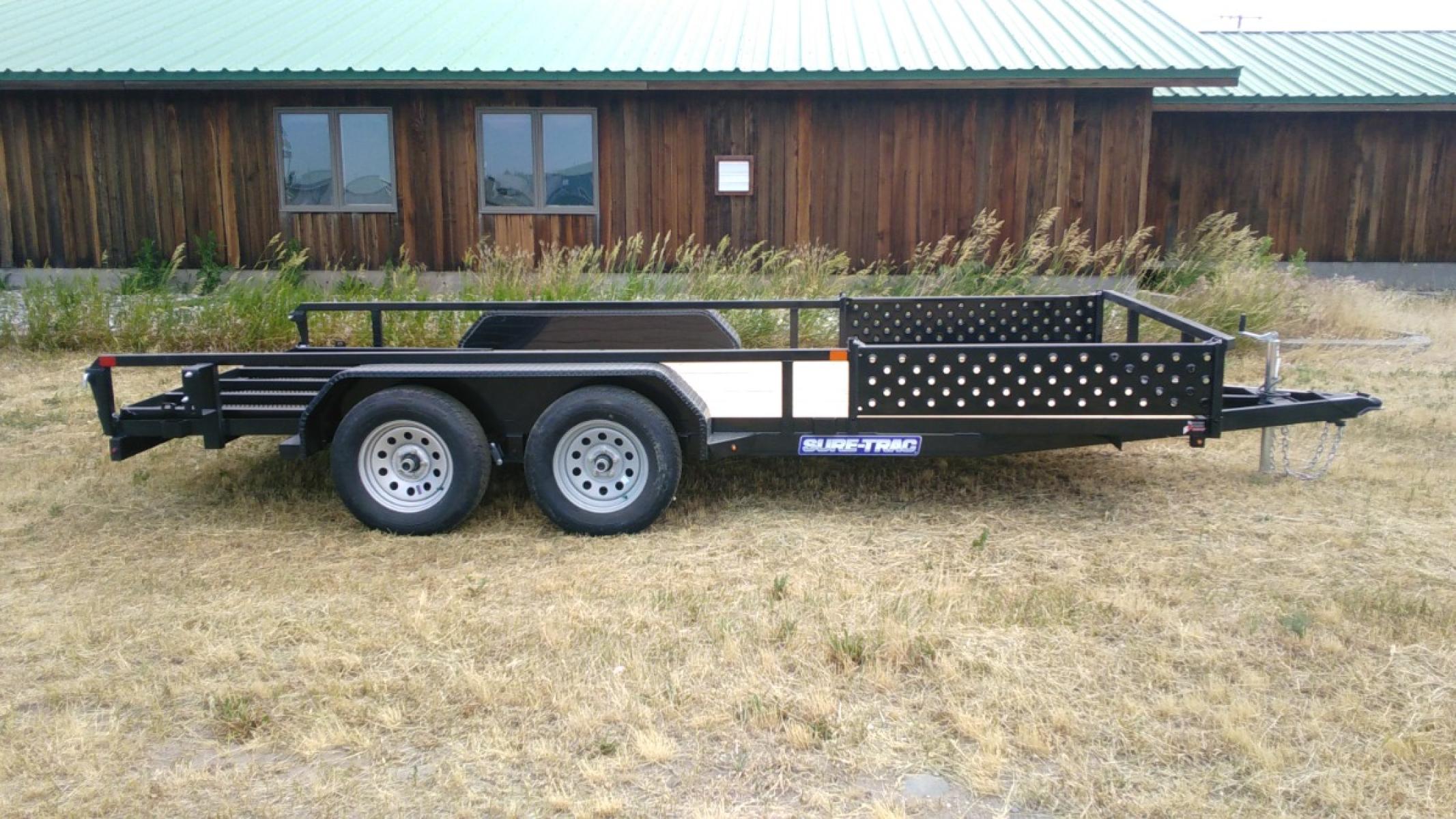 2023 Black SureTrac 7 x 16 Utility ATV , located at 310 West 1st Ave, Big Timber, MT, 59011, (406) 860-8510, 45.833511, -109.957809 - SURE-TRAC 7 X 16 TUBE TOP ATV, 7K GVW, SIDE AND REAR RAMPS, 15" RADIAL TIRES, BRAKES BOTH AXLES, EASY LUBE HUBS, LED LIGHTS, TREATED WOOD DECK, POWDER COAT FINISH, WIRING RUN IN CONDUIT, STAKE POCKETS, SPRING ASSIST REAR RAMP, SPARE TIRE MOUNT. OPTION: Spare Tire - $165.00. THE BEST TRAILERS AT - Photo #0