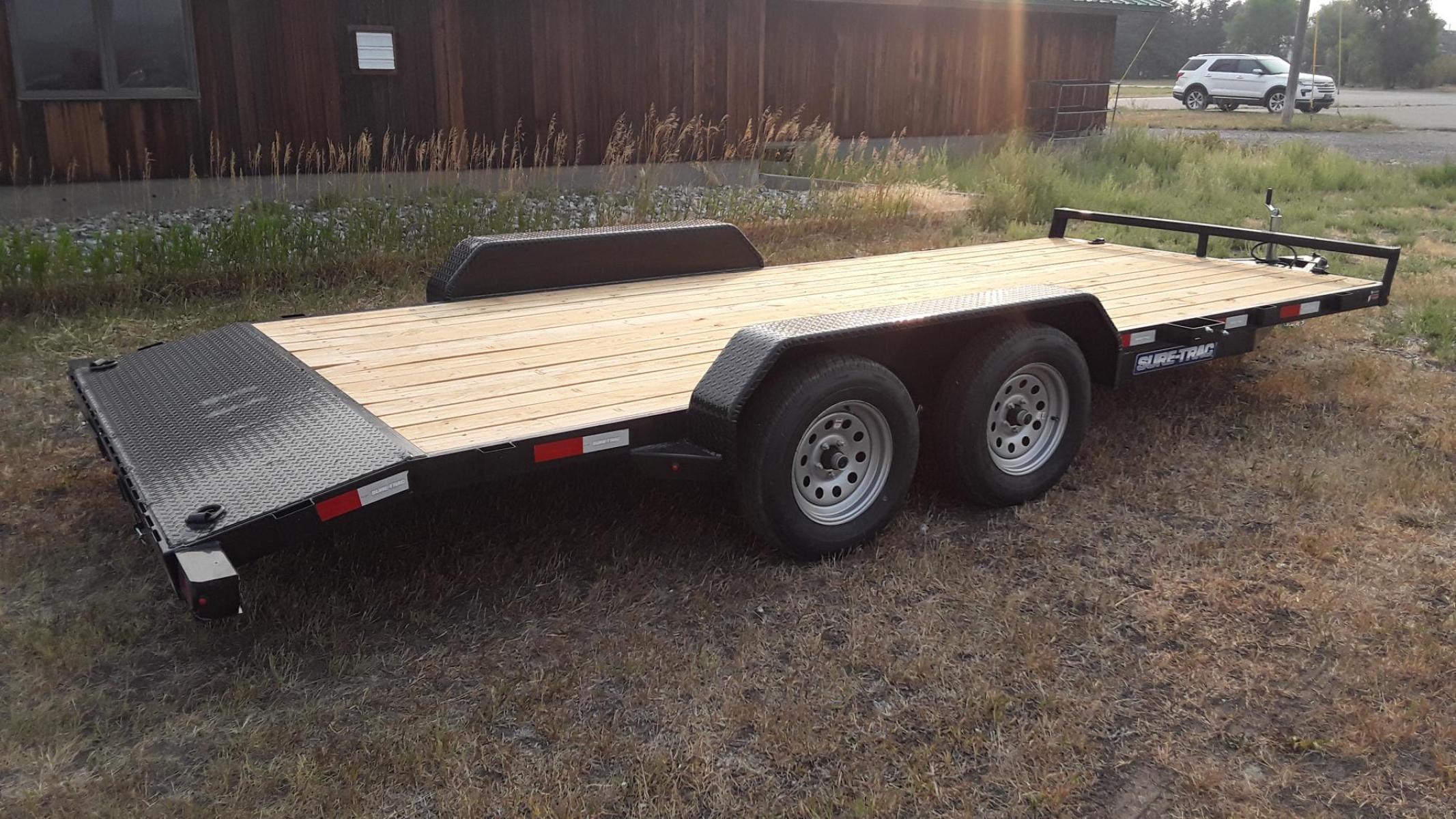 2023 Black SureTrac 7 x 18 - 7K Car Hauler , located at 310 West 1st Ave, Big Timber, MT, 59011, (406) 860-8510, 45.833511, -109.957809 - SURE-TRAC 7 X 18 C-CHANNEL CAR HAULER, 7K GVW, ELECTRIC BRAKES BOTH AXLES, REAR STOW RAMPS, LED LIGHTS, TREATED WOOD DECK, POWDER COAT FINISH, REMOVABLE FENDER ON DRIVERS SIDE, (4) D-RING TIE DOWNS, STAKE POCKETS, 2' TREAD PLATE DOVETAIL, EZ LUBE HUBS, 15' RADIAL TIRES, SPRING SUSPENSION, SPARE MOUN - Photo #2