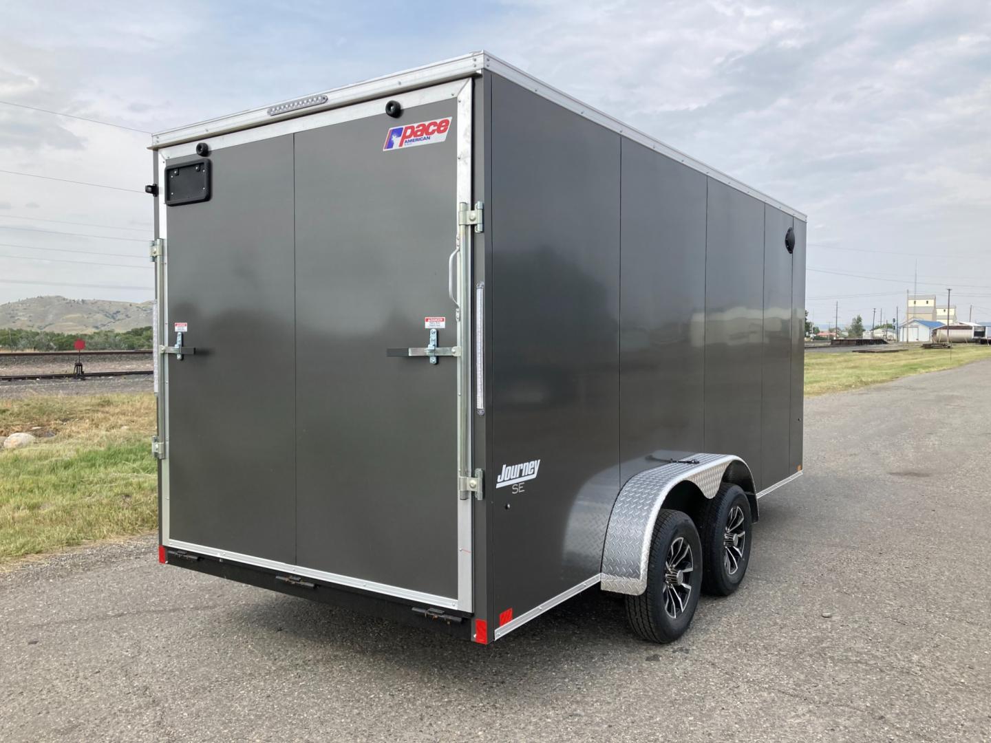 2025 Charcoal Pace 7 x 16 Journey SE , located at 310 West 1st Ave, Big Timber, MT, 59011, (406) 901-0517, 45.833511, -109.957809 - NEW PACE 7 X 16 JOURNEY SE V-NOSE CARGO TRAILER, 7K GVW, 78" REAR OPENING DOOR HEIGHT, TUBE SIDEWALL SUPPORTS ON 16" CENTERS, FLOOR CROSSMEMBERS ON 16" CENTERS, BONDED EXTERIOR (SCREWLESS), TUBE FRAME CONSTRUCTION, 15" RADIAL TIRES, EZ LUB HUBS, REAR RAMP DOOR, FLUSH MOUNTED RV SIDE DOOR W- LOCK, BR - Photo#4