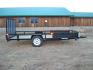 2025 Black SureTrac 7 x 14 ATV , located at 310 West 1st Ave, Big Timber, MT, 59011, (406) 901-0517, 45.833511, -109.957809 - SURE-TRAC 7 X 14 TUBE TOP ATV, 3K GVW, SIDE RAMPS, SPRING ASSISTED REAR RAMP, 15" RADIAL TIRES, TREATED WOOD DECK, LED LIGHTS, WIRING RUN IN CONDUIT, POWDER COAT FINISH, SPARE TIRE MOUNT. SURE-TRAC QUALITY FIT AND FINISH. OPTIONAL SPARE TIRE - $165.00. THE BEST TRAILERS AT THE BEST PRICE!!! Traile - Photo#0