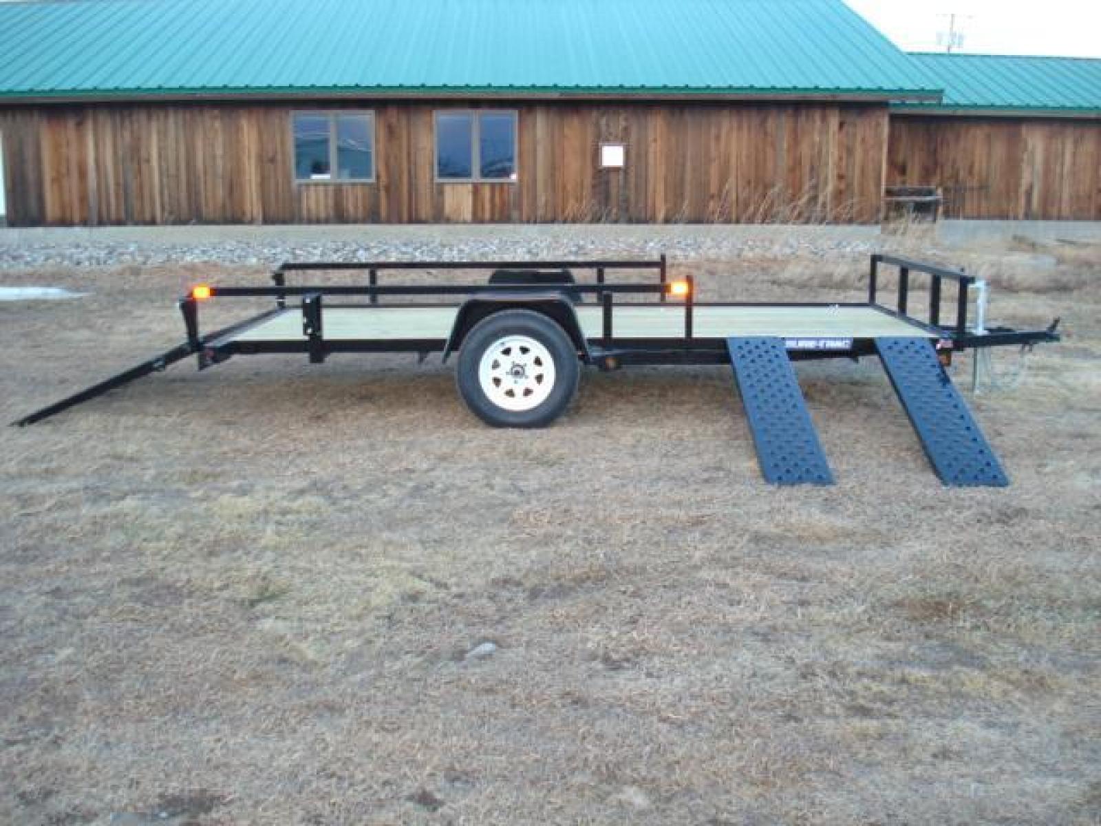 2023 Black SureTrac 7 x 14 ATV , located at 310 West 1st Ave, Big Timber, MT, 59011, (406) 860-8510, 45.833511, -109.957809 - SURE-TRAC 7 X 14 TUBE TOP ATV, 3K GVW, SIDE RAMPS, SPRING ASSISTED REAR RAMP, 15" RADIAL TIRES, TREATED WOOD DECK, LED LIGHTS, WIRING RUN IN CONDUIT, POWDER COAT FINISH, SPARE TIRE MOUNT. SURE-TRAC QUALITY FIT AND FINISH. OPTIONAL SPARE TIRE - $165.00. THE BEST TRAILERS AT THE BEST PRICE!!! Traile - Photo #5