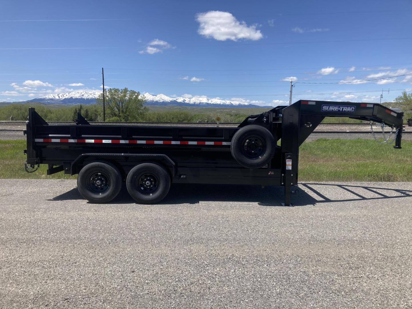 2025 Black SureTrac 7 x 14 GN LoPro Dump , located at 310 West 1st Ave, Big Timber, MT, 59011, (406) 901-0517, 45.833511, -109.957809 - NEW SURE-TRAC 7 X 14 LOPRO GN DUMP, 14K GVW, HD TELESCOPIC HOIST, 10 GA FLOOR, HD SLIPPER SPRING SUSPENSION, 7K AXLES W- EZ LUBE HUBS, LED LIGHTS, ELECTRIC BRAKES BOTH AXLES, COMBO BARN DOOR-SPREADER REAR GATE, HD REAR STOW RAMPS, 10 PLY - 16" RADIAL TIRES, STAKE POCKETS, ADJUSTABLE GN COUPLER, (5) - Photo#1