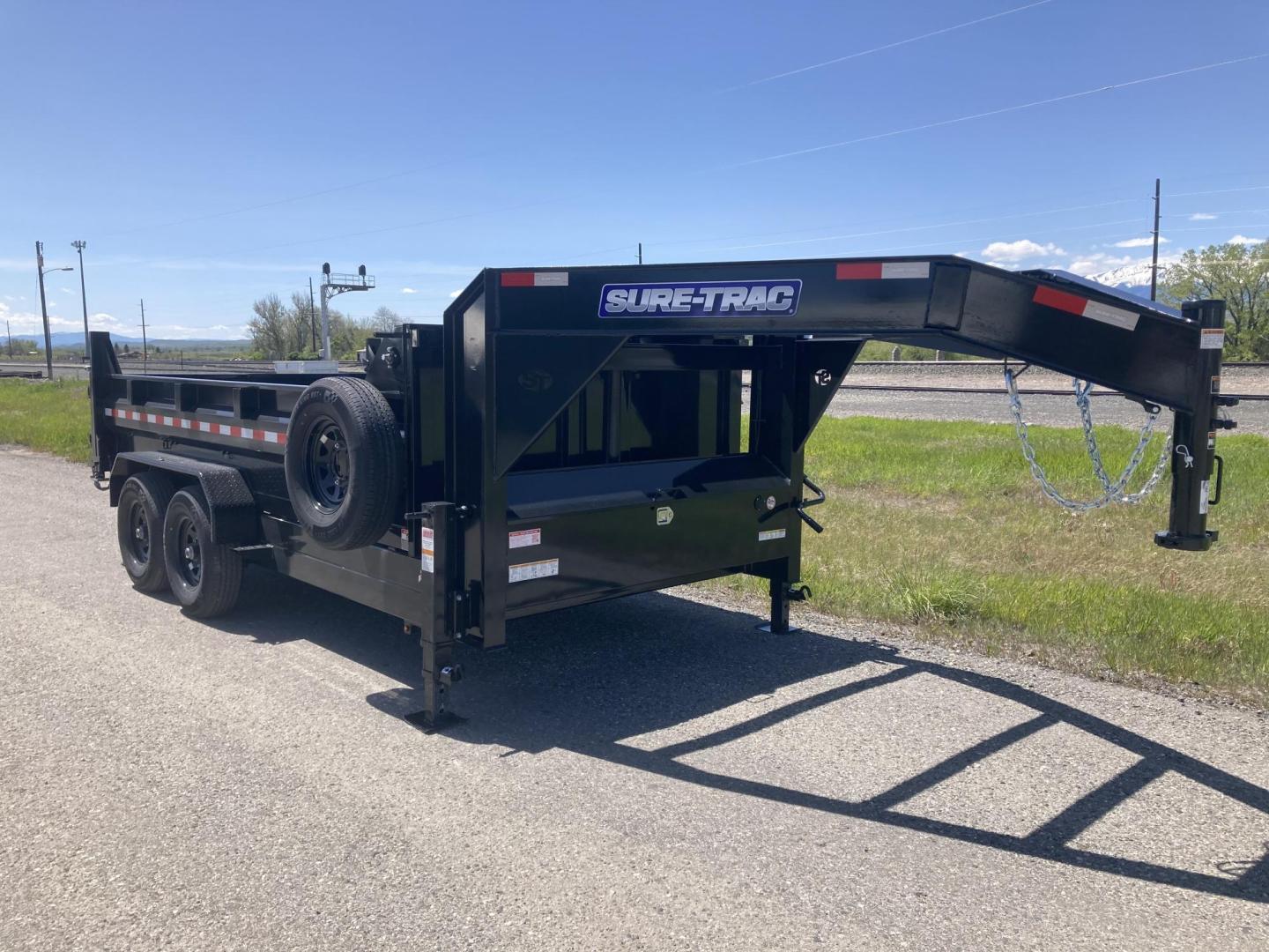 2025 Black SureTrac 7 x 14 GN LoPro Dump , located at 310 West 1st Ave, Big Timber, MT, 59011, (406) 901-0517, 45.833511, -109.957809 - NEW SURE-TRAC 7 X 14 LOPRO GN DUMP, 14K GVW, HD TELESCOPIC HOIST, 10 GA FLOOR, HD SLIPPER SPRING SUSPENSION, 7K AXLES W- EZ LUBE HUBS, LED LIGHTS, ELECTRIC BRAKES BOTH AXLES, COMBO BARN DOOR-SPREADER REAR GATE, HD REAR STOW RAMPS, 10 PLY - 16" RADIAL TIRES, STAKE POCKETS, ADJUSTABLE GN COUPLER, (5) - Photo#2