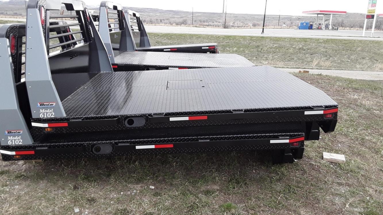 2022 Black Besler Flatbed , located at 80 Big Timber Loop Road, Big Timber, MT, 59011, (406) 860-8510, 45.837139, -109.951393 - ALL NEW BESLER 6000 SERIES FLATBED, GN HITCH W- 30K TOW BALL, REAR RECEIVER HITCH, 7 ROUND TRAILER PLUGS, LED LIGHTS, STAKE POCKETS-RUB RAIL, TAPERED REAR. 7 X 7 FOR SHORT WHEEL BASE PU - $4,250.00. 7 X 81-2 FOR LONG WHEEL BASE PU - Call.	FOLD DOWN SIDES - ADD $200.00. INSTALLATION AVAILABLE - Photo #0