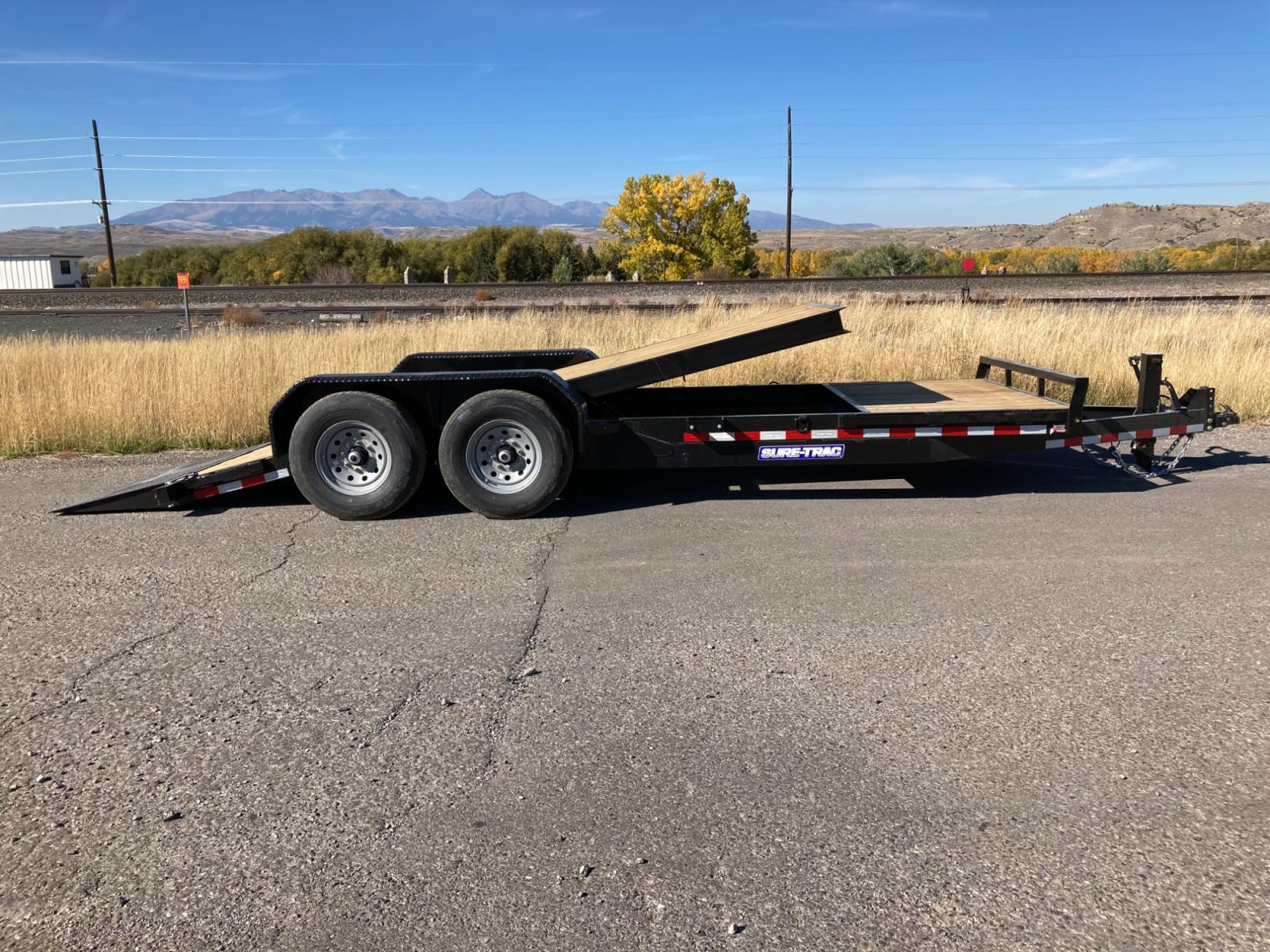 2023 SureTrac 7 x 16 + 4 Equipment Tilt , located at 310 West 1st Ave, Big Timber, MT, 59011, (406) 860-8510, 45.833511, -109.957809 - New SureTrac 7 x 16 + 4 Equipment Tilt, 14K GVW, 16' tilt - 4' stationary deck, 6" c-channel and tube frame construction, 6" c-channel full wrap tongue, 3" c-channel crossmembers on 16" centers, HD slipper spring suspension, EZ lube hubs, electric brakes both axles, 2 x 6 treated deck, 12k drop leg - Photo #6