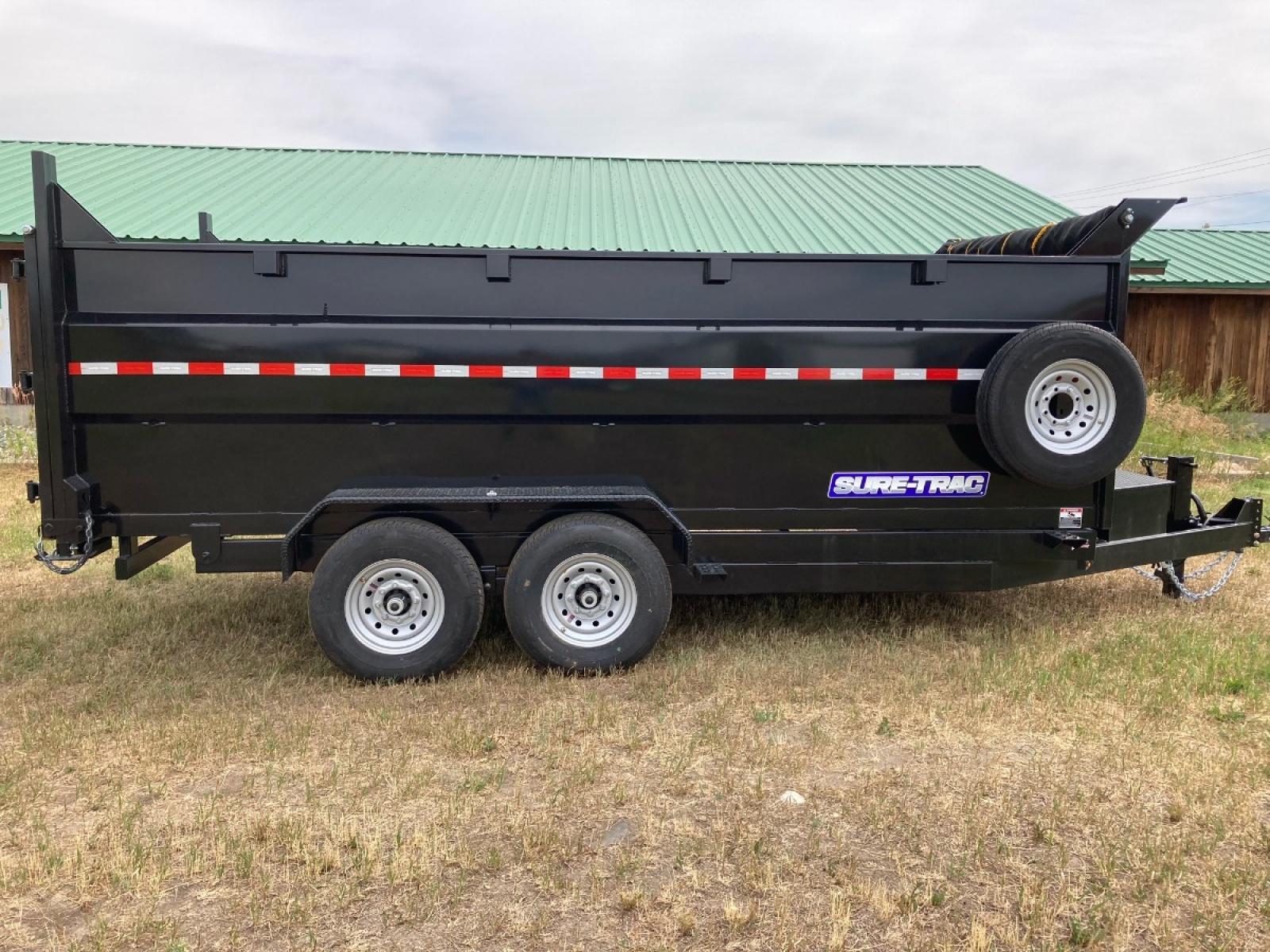 2022 SureTrac 7 x 16 LoPro dump - 14K GVW , located at 310 West 1st Ave, Big Timber, MT, 59011, (406) 860-8510, 45.833511, -109.957809 - New 2022 SureTrac 7 x 16 LoPro Dump, 14k GVW, 4' side walls, telescopic hoist, HD slipper spring suspension, 16" - 10 ply radial tires, ez lube hubs, matching spare tire, mesh tarp, 110 volt battery charger, set back 12k drop leg jack, (5) D-ring tie downs, 10 ga floor, all LED lights, rear stow ram - Photo #0