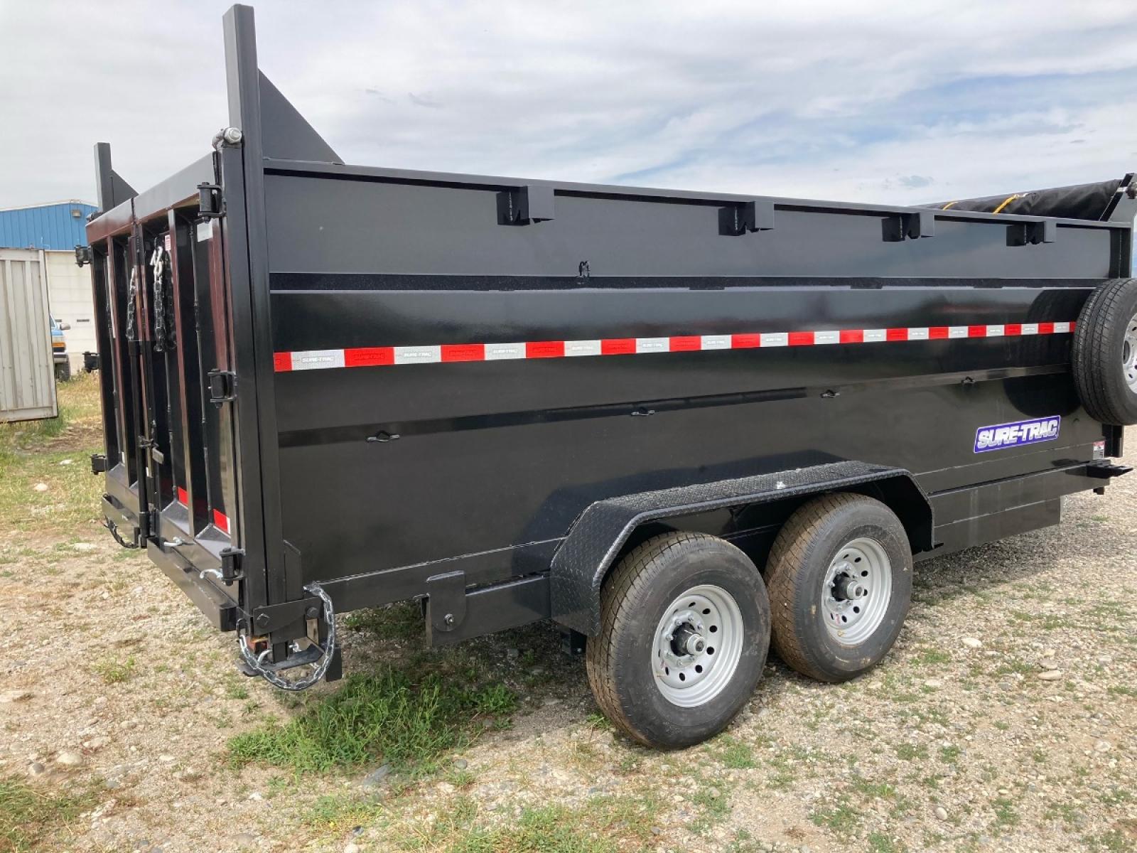 2022 SureTrac 7 x 16 LoPro dump - 14K GVW , located at 310 West 1st Ave, Big Timber, MT, 59011, (406) 860-8510, 45.833511, -109.957809 - New 2022 SureTrac 7 x 16 LoPro Dump, 14k GVW, 4' side walls, telescopic hoist, HD slipper spring suspension, 16" - 10 ply radial tires, ez lube hubs, matching spare tire, mesh tarp, 110 volt battery charger, set back 12k drop leg jack, (5) D-ring tie downs, 10 ga floor, all LED lights, rear stow ram - Photo #1