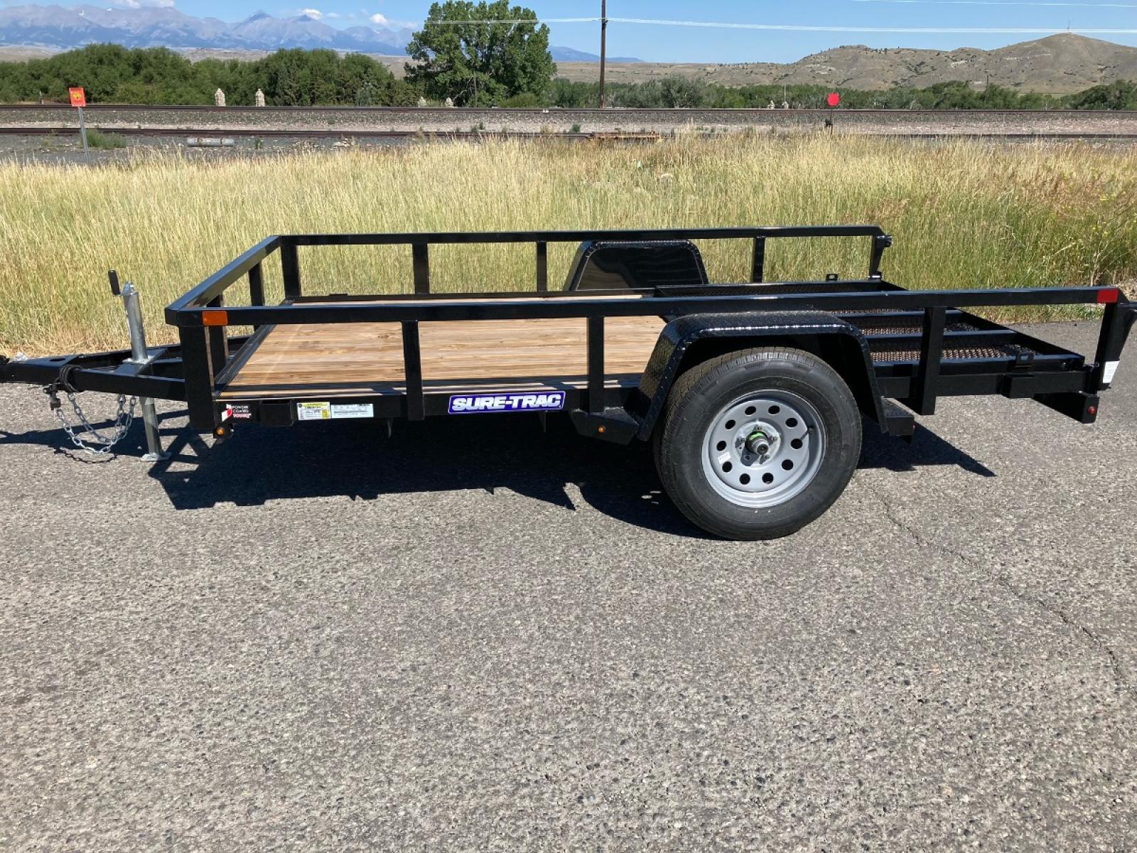2022 Black SureTrac 6 x 10 Tube Top Utility , located at 310 West 1st Ave, Big Timber, MT, 59011, (406) 860-8510, 45.833511, -109.957809 - New 2022 SureTrac 6 x 10 Tube Top Utility, 3k GVW, (3) position rear gate, 2" x 2" top tube railing - 12" tall, ez lube hubs, treated wood deck, LED lights, wiring run in conduit, set back 2k jack, 15" radial tires, spare mount, powder coat finish. The BEST Trailers at the Best Price!!! Traile - Photo #0