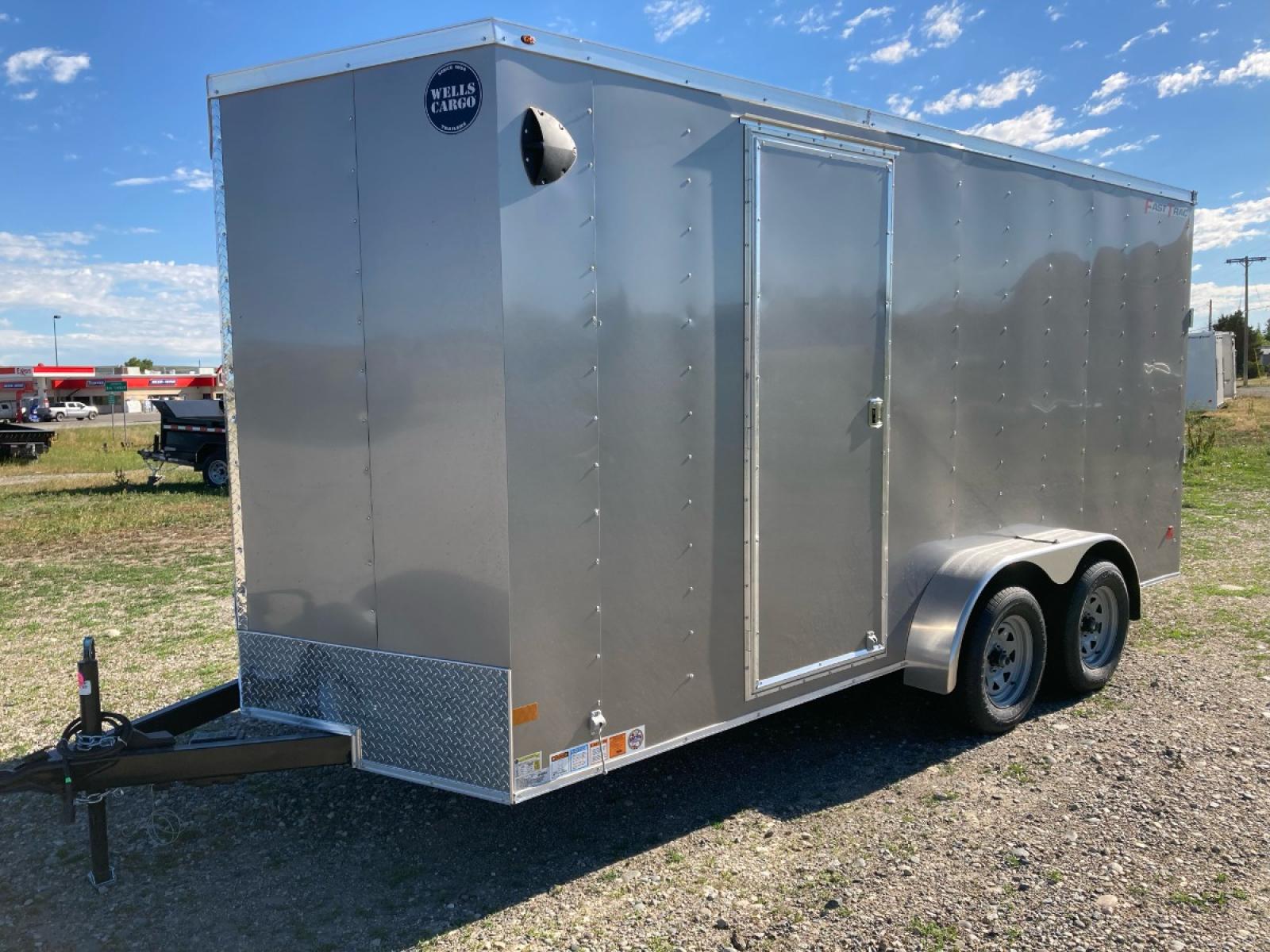 2022 White Wells Cargo Fast Trac 7 x 14 , located at 310 West 1st Ave, Big Timber, MT, 59011, (406) 860-8510, 45.833511, -109.957809 - Wells Cargo Fast Trac 7 x 14 V-nose, 7k GVW, rear ramp door with 78" rear door opening height (fits a side by side), spring suspension, electric brakes all wheels, 15" radial tires, ez lube hubs, (4) d-ring tie-downs, Plexcore 3/4" floor, economy sidewall liner, flow through sidewall vents, one piec - Photo #0