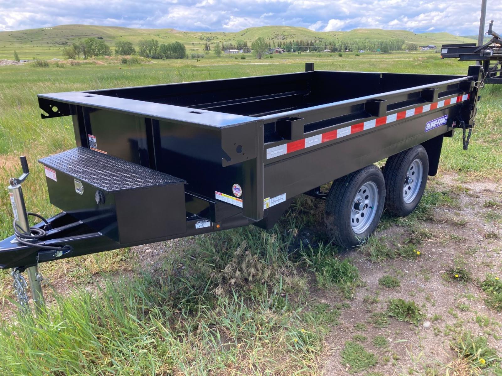 2022 SureTrac 6 x 10 Deckover Dump Trailer , located at 310 West 1st Ave, Big Timber, MT, 59011, (406) 860-8510, 45.833511, -109.957809 - New SureTrac 6 x 10 Deckover Dump, 7k GVW, 16" sides with integrated side body stiffeners, tube frame construction, single ram hoist with power up/down, deep cycle marine battery, 110 volt battery charger, 15" radial tires, combination barn door/spreader rear gate, stake pockets, set back jack, all - Photo #1
