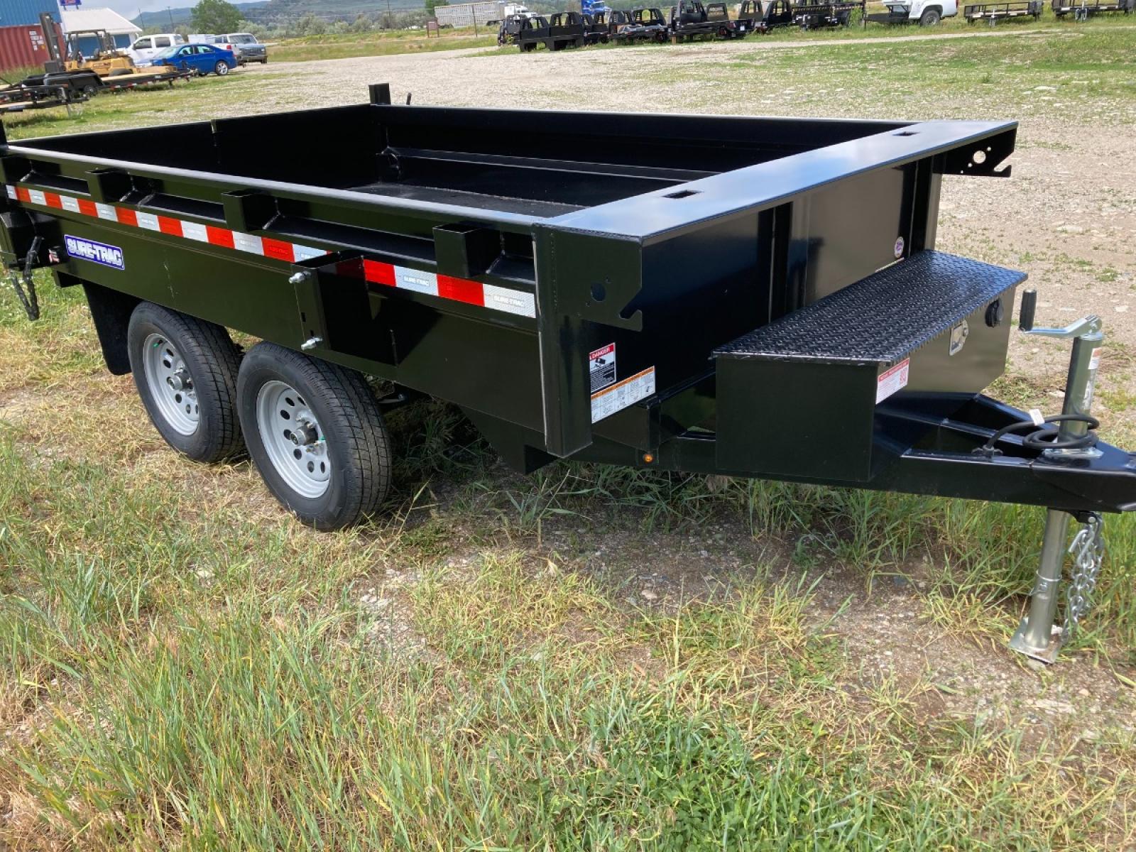 2022 SureTrac 6 x 10 Deckover Dump Trailer , located at 310 West 1st Ave, Big Timber, MT, 59011, (406) 860-8510, 45.833511, -109.957809 - New SureTrac 6 x 10 Deckover Dump, 7k GVW, 16" sides with integrated side body stiffeners, tube frame construction, single ram hoist with power up/down, deep cycle marine battery, 110 volt battery charger, 15" radial tires, combination barn door/spreader rear gate, stake pockets, set back jack, all - Photo #3