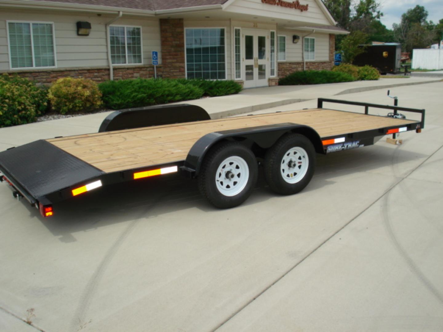 2025 , located at 310 West 1st Ave, Big Timber, MT, 59011, (406) 901-0517, 45.833511, -109.957809 - NEW SURE-TRAC 7 X 16 C-CHANNEL CAR HAULER, 7K GVW, ELECTRIC BRAKES BOTH AXLES, REAR STOW RAMPS, LED LIGHTS, TREATED WOOD DECK, (4) D-RING TIE DOWNS, STAKE POCKETS, 2' TREAD PLATE DOVETAIL, EZ LUBE HUBS, 15" RADIAL TIRES, SPRING SUSPENSION, SPARE MOUNT, SET BACK TOP WIND JACK, POWDER COAT FINISH. - Photo#1